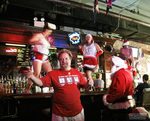 Santas have taken over a bar